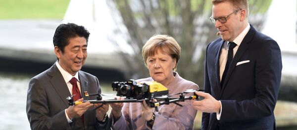 Angela Merkel - Şinzo Abe / İHA - Sputnik Türkiye