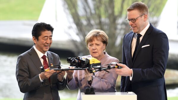 Angela Merkel - Şinzo Abe / İHA - Sputnik Türkiye