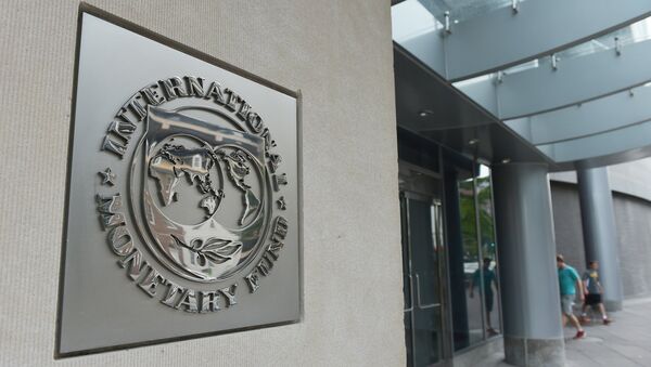 The seal of the International Monetary Fund is seen on a headquarters building in Washington - Sputnik Türkiye