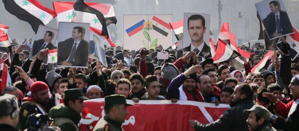 Suriye Devlet Başkanı Beşar Esad için Halep'te yapılan bir eylem - Sputnik Türkiye