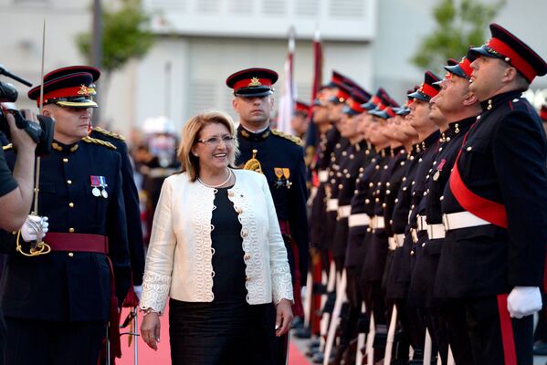 Malta's President Marie-Louise Coleiro Preca inspects as guards stand at attention, in the Maltese capital Valletta, after taking her oaf of office, on April 4, 2014. - Sputnik Türkiye