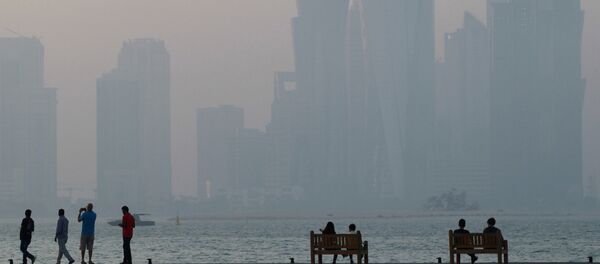 People sit on the corniche in Doha, Qatar, June 15, 2017. - Sputnik Türkiye
