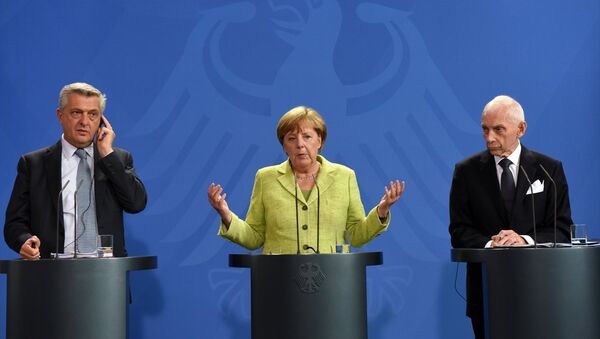 BM Mülteciler Yüksek Komiseri Filippo Grandi, Almanya Başbakanı Angela Merkel, Uluslararası Göç Örgütü (IOM) Genel Direktörü William Lacy Swing - Sputnik Türkiye