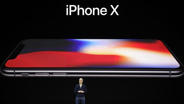 Apple CEO Tim Cook announces the new iPhone X at the Steve Jobs Theater on the new Apple campus, Tuesday, Sept. 12, 2017, in Cupertino, California. - Sputnik Türkiye