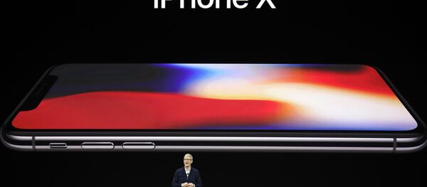 Apple CEO Tim Cook announces the new iPhone X at the Steve Jobs Theater on the new Apple campus, Tuesday, Sept. 12, 2017, in Cupertino, California. - Sputnik Türkiye