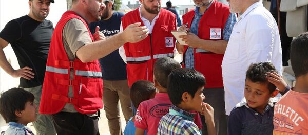 Türk Kızılayı Genel Başkanı Kerem Kınık İdlib'de incelemelerde bulundu - Sputnik Türkiye