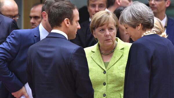 Fransa Cumhurbaşkanı Emmanuel Macron, Almanya Başbakanı Angela Merkel, İngiltere Başbakanı Theresa May - Sputnik Türkiye