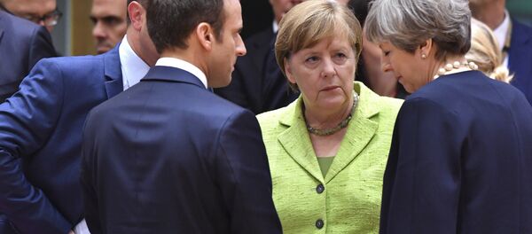 Fransa Cumhurbaşkanı Emmanuel Macron, Almanya Başbakanı Angela Merkel, İngiltere Başbakanı Theresa May - Sputnik Türkiye