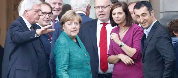 Almanya Başbakanı Angela Merkel ile Yeşiller Partisi Eş Başkanı Cem Özdemir - Sputnik Türkiye