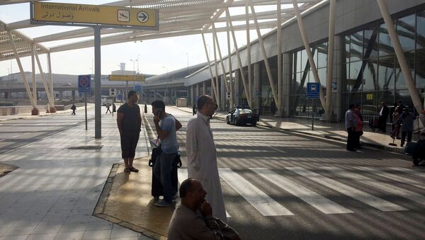 People wait outside the international arrivals terminal at Cairo Airport, Egypt May 19, 2016 - Sputnik Türkiye
