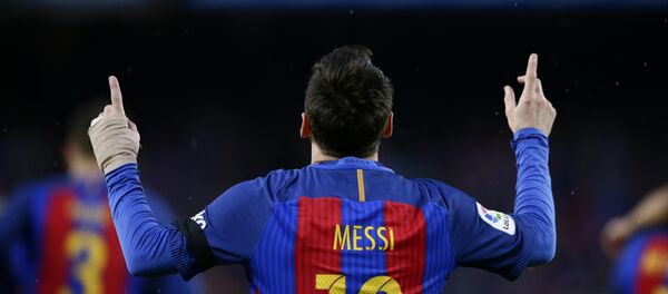 FC Barcelona's Lionel Messi celebrates after scoring during the Spanish La Liga soccer match between FC Barcelona and Sevilla at the Camp Nou stadium in Barcelona, Spain, Wednesday, April 5, 2017 - Sputnik Türkiye