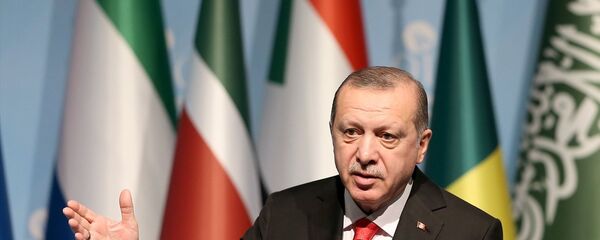 Cumhurbaşkanı Recep Tayyip Erdoğan, İslam İşbirliği Teşkilatı (İİT) Zirvesi'nin ardından basın toplantısı düzenledi - Sputnik Türkiye