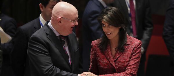 Russian Ambassador to the United Nations Vasily Nebenzya, left, and United States Ambassador to the U.N. Nikki Haley shake hands before a Security Council meeting, Tuesday, April 10, 2018, at U.N. headquarters - Sputnik Türkiye