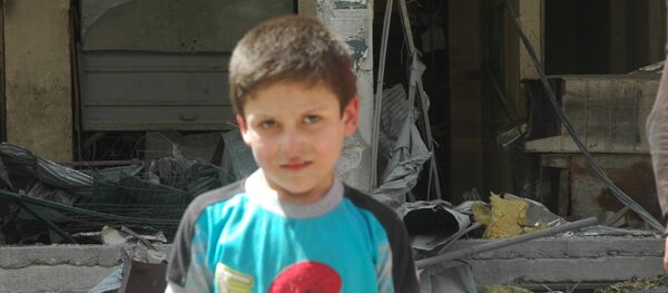 Beyaz Miğferler’in ‘kimyasal saldırı’ videosunda yer alan çocuklardan biri, 10 yaşındaki Mustafa - Sputnik Türkiye