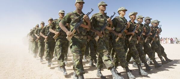 Polisario Front soldiers raise dust in their wake during a military parade in the Western Sahara village of Tifariti, file photo. - Sputnik Türkiye