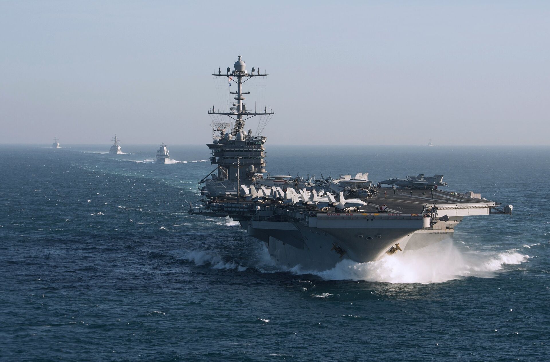 The aircraft carrier group of the United States Navy led by USS Harry S. Truman, front, and a ship escort are seen leaving the port of Norfolk heading for the Middle East The aircraft carrier group of the United States Navy led by USS Harry S. Truman, front, and a ship escort are seen leaving the port of Norfolk heading for the Middle East - Sputnik Türkiye, 1920, 16.12.2025