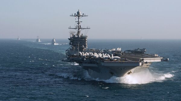 The aircraft carrier group of the United States Navy led by USS Harry S. Truman, front, and a ship escort are seen leaving the port of Norfolk heading for the Middle East - Sputnik Türkiye