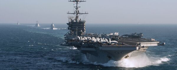The aircraft carrier group of the United States Navy led by USS Harry S. Truman, front, and a ship escort are seen leaving the port of Norfolk heading for the Middle East - Sputnik Türkiye