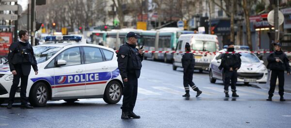 French police secure the area after a man was shot dead at a police station in the 18th district in Paris, France January 7, 2016 - Sputnik Türkiye