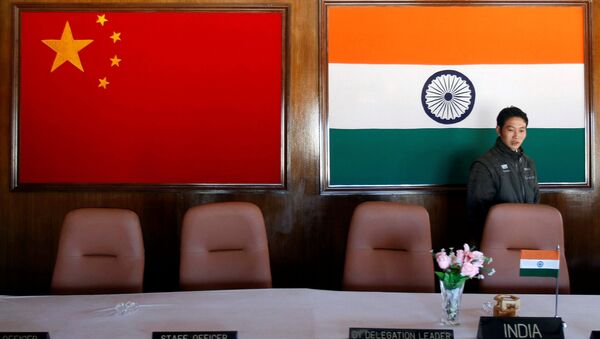A man walks inside a conference room used for meetings between military commanders of China and India, at the Indian side of the Indo-China border at Bumla, in the northeastern Indian state of Arunachal Pradesh, November 11, 2009 - Sputnik Türkiye