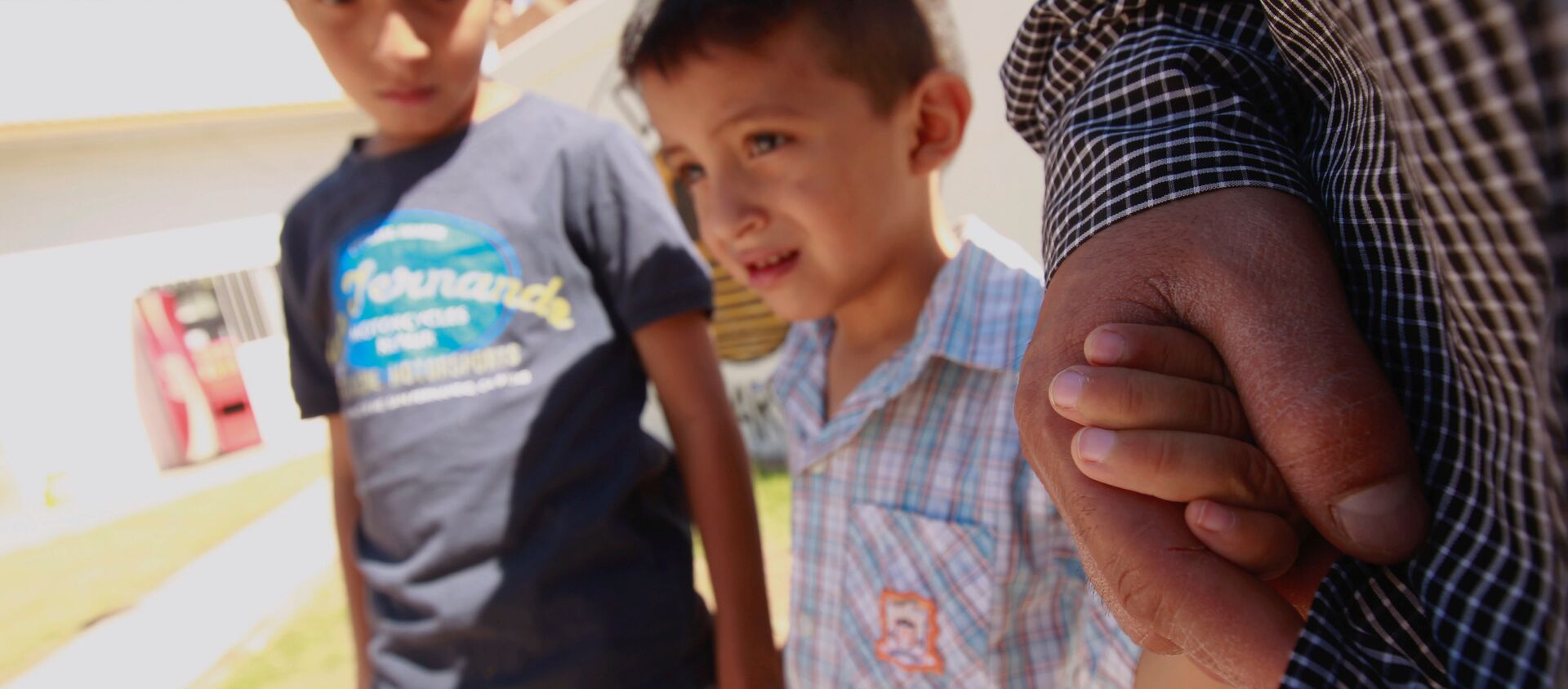 ABD'deki göçmen çocukları ayırma politikası nedeniyle Meksika'daki sığınmacı kampında kalan El Salvadorlu göçmen ve çocukları - Sputnik Türkiye, 1920, 05.01.2021