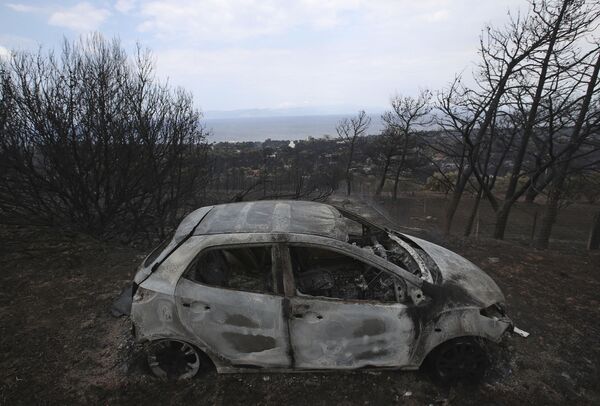 Yangın 23 Temmuz’da Yunanistan başkentinden yaklaşık 50 kilometre uzaklığında bulunan Kineta tatil beldesine yakın bir yerde meydana geldi. - Sputnik Türkiye