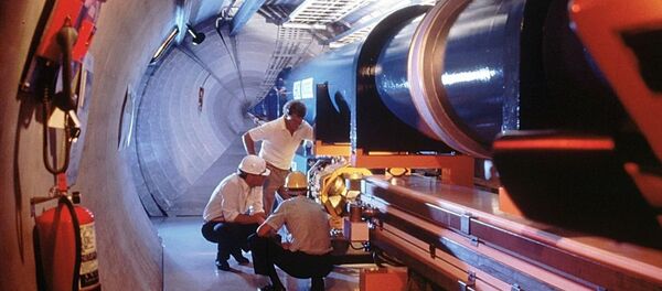 An undated picture released by the CERN, European Council for Nuclear Research, shows a mock-up of the Large Hadron Collidor or LHC atom-smasher which is to be built in an existing 27 kilometers tunnel near Geneva - Sputnik Türkiye
