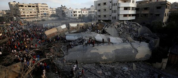 İsrail'in 9 Ağustos 2018'de Gazze'ye yönelik hava saldırısı sonucu tamamen yıkılan kültür merkezi binası - Sputnik Türkiye