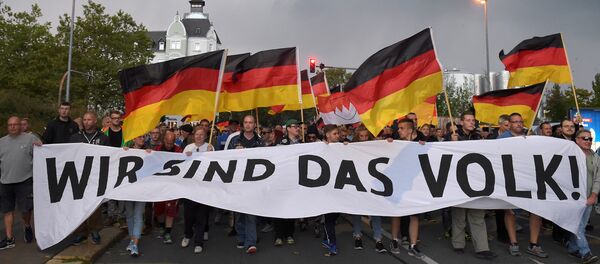 Almanya'nın doğusundaki Chemnitz kentinde göçmenlere tartışan bir kişinin ölümü sonrası aşırı sağcılar pek çok gösteri düzenlendi. - Sputnik Türkiye