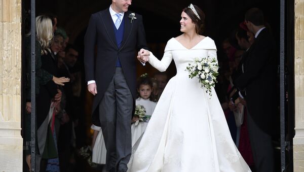 Britain's Princess Eugenie and Jack Brooksbank leave St George's Chapel after their wedding at Windsor Castle, near London, England, Friday Oct. 12, 2018. - Sputnik Türkiye