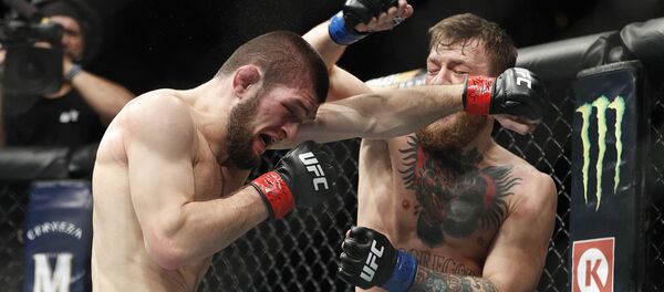 İrlandalı Conor McGregor ve Dağıstanlı Khabib Nurmagomedov'u karşı karşıya getiren UFC hafif sıklet unvan maç. İrlandalı Conor McGregor ve Dağıstanlı Khabib Nurmagomedov'u karşı karşıya getiren UFC hafif sıklet unvan maç. - Sputnik Türkiye