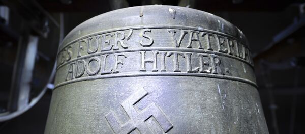 Church bell with the inscription Everything for the fatherland Adolf Hitler and a swastika is pictured in the town church in Herxheim am Berg, western Germany. (File) - Sputnik Türkiye