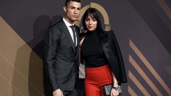 In this March 19, 2018 file photo, Real Madrid player Cristiano Ronaldo and his girlfriend Georgina Rodriguez pose for photos as they arrive for the Portuguese soccer federation awards ceremony in Lisbon - Sputnik Türkiye