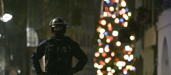 A policeman patrols in the rue des Grandes Arcades in Strasbourg, eastern France, after a shooting breakout, on December 11, 2018. - Sputnik Türkiye