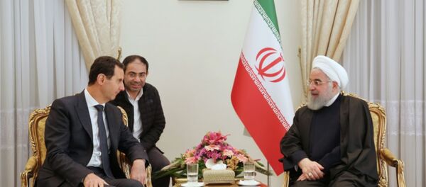 Suriye savaşının başlangıcından beri ilk: Esad, İran'da Ruhani ile görüştü - Sputnik Türkiye