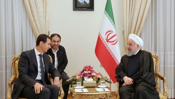 Suriye savaşının başlangıcından beri ilk: Esad, İran'da Ruhani ile görüştü - Sputnik Türkiye