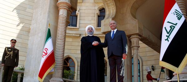 İran Cumhurbaşkanı Hasan Ruhani, resmi ziyaret kapsamında ilk kez gittiği Irak'ın başkenti Bağdat'ta Cumhurbaşkanı Berhem Salih tarafından karşılandı. - Sputnik Türkiye