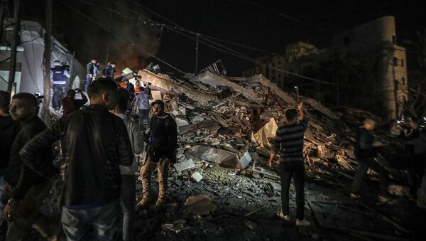 İsrail'in Gazze'ye yönelik hava saldırısında AA ofisinin bulunduğu bina en az 5 roketle vurularak enkaza döndü. - Sputnik Türkiye