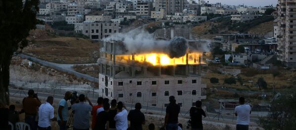 İsrail 9 katlı binayı havaya uçurdu İsrail 9 katlı binayı havaya uçurdu - Sputnik Türkiye