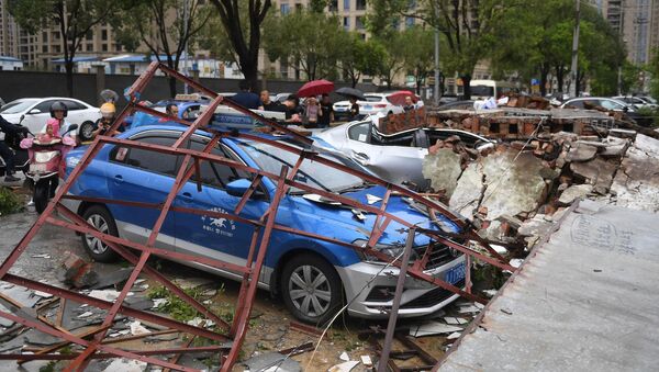 Cars are damaged after typhoon Lekima made landfall in Wenling, Zhejiang province, China August 10, 2019. Wang Gang/CNS via REUTERS ATTENTION EDITORS - THIS IMAGE WAS PROVIDED BY A THIRD PARTY. CHINA OUT. - Sputnik Türkiye