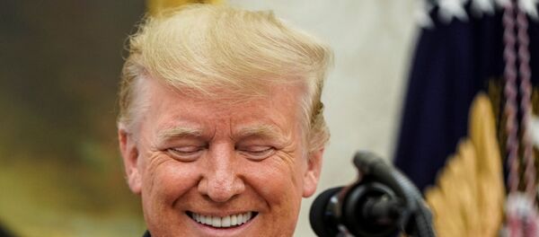 U.S. President Donald Trump speaks prior to presenting NBA Hall of Fame player Jerry West with the Presidential Medal of Freedom in the Oval office of the White House in Washington, U.S., September 5, 2019.      REUTERS/Joshua Roberts - Sputnik Türkiye