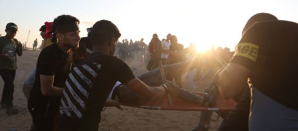 İsrail ablukası altındaki Gazze Şeridi sınırında düzenlenen 'Büyük Dönüş Yürüyüşü' gösterilerine müdahale - Sputnik Türkiye