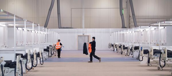 Londra'daki ExCel Fuar Merkezi'nin NHS Nightingale Sahra Hastanesi'ne çevrilmesi çalışmalarından Londra'daki ExCel Fuar Merkezi'nin NHS Nightingale Sahra Hastanesi'ne çevrilmesi çalışmalarından - Sputnik Türkiye